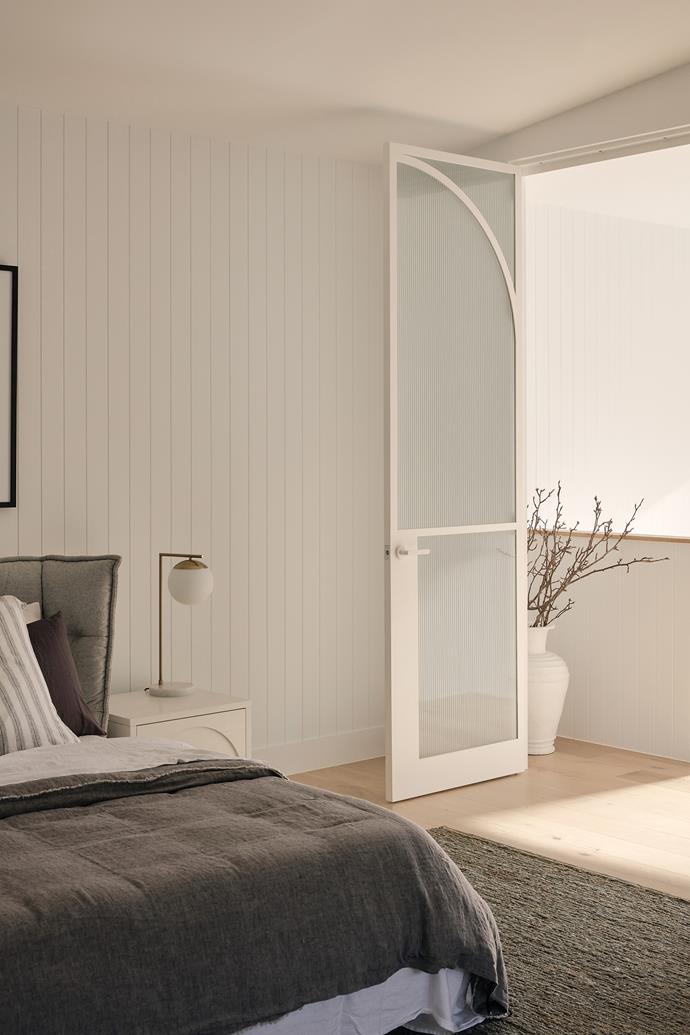 Steel arched French doors lead to the luxurious parents' retreat, complete with a shiplap feature wall, [B&B Italia](https://www.bebitalia.com/en/|target="_blank"|rel="nofollow") 'Huski' bed, Archie bedsides from [GlobeWest](https://www.globewest.com.au/|target="_blank"|rel="nofollow") and Remi brass lights from Mayfield. Luxe bedlinen was sourced from [Hale Mercantile Co](https://halemercantilecolinen.com/|target="_blank"|rel="nofollow") and [In Bed](https://inbedstore.com/|target="_blank"|rel="nofollow").