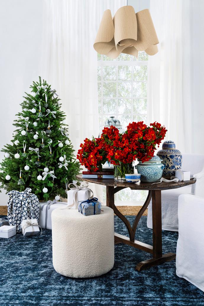 Balsam fir artificial Christmas tree, [Balsam Hill](https://www.balsamhill.com.au/|target="_blank"|rel="nofollow"). 'Bill' bouclé pouf in Ivory, $449, [McMullin & Co](https://www.mcmullinandco.com/|target="_blank"|rel="nofollow").'Camila 67' pendant light in Ash, $2079, [Enlightened Living](https://enlightened-living.com.au/|target="_blank"|rel="nofollow"). Alstroemeria floral arrangement and vase, [Hermetica Flowers](https://www.hermeticaflowers.com.au/|target="_blank"|rel="nofollow"). Porcelain container in Blue and White, [Orient House](https://www.orienthouse.com.au/|target="_blank"|rel="nofollow"). 'Vintage Revive' wool rug in Navy, $6228/3.92m x 2.86m, [Tribe Home](https://tribehome.com.au/|target="_blank"|rel="nofollow").