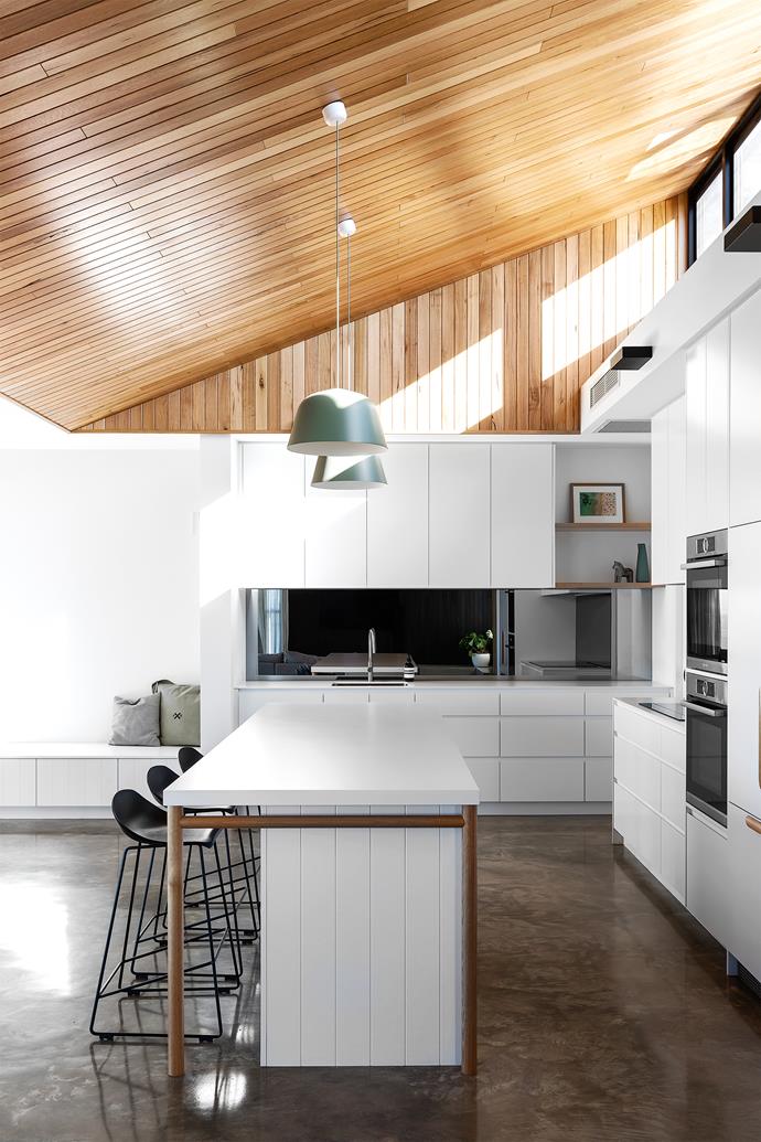 Honey-coloured Tasmanian oak cladding on the ceiling draws the eye upwards. The cabinets and island base, both installed by David John Joinery, are painted White On White by Dulux. Silestone island benchtop, [Cosentino](https://www.cosentino.com/en-au/|target="_blank"|rel="nofollow"). Muuto 'Ambit' pendants, [Living Edge](https://livingedge.com.au/|target="_blank"|rel="nofollow"). Stools, [Haven & Space](https://havenandspace.com.au/|target="_blank"|rel="nofollow").
