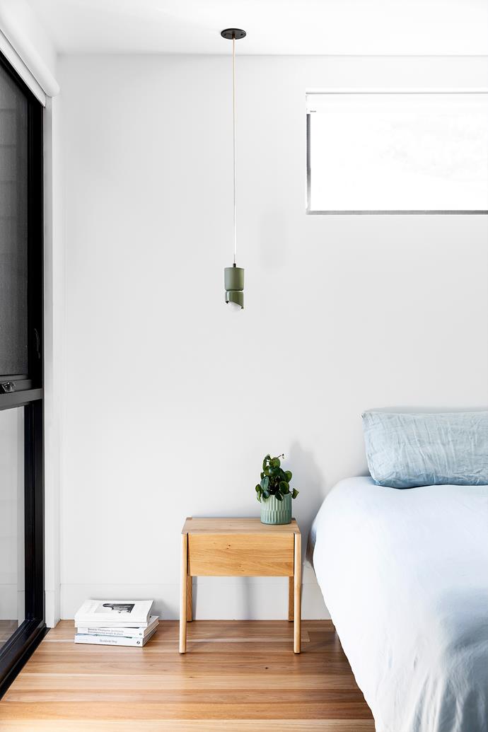 Clerestory windows brighten the main bedroom, while pale-blue bed linen from [Linen House](https://www.linenhouse.com/|target="_blank"|rel="nofollow") sends soothing signals. Bedside table, [RJ Living](https://www.rjliving.com.au/|target="_blank"|rel="nofollow"). Terra pendant, [Marz Designs](https://marzdesigns.com/|target="_blank"|rel="nofollow").