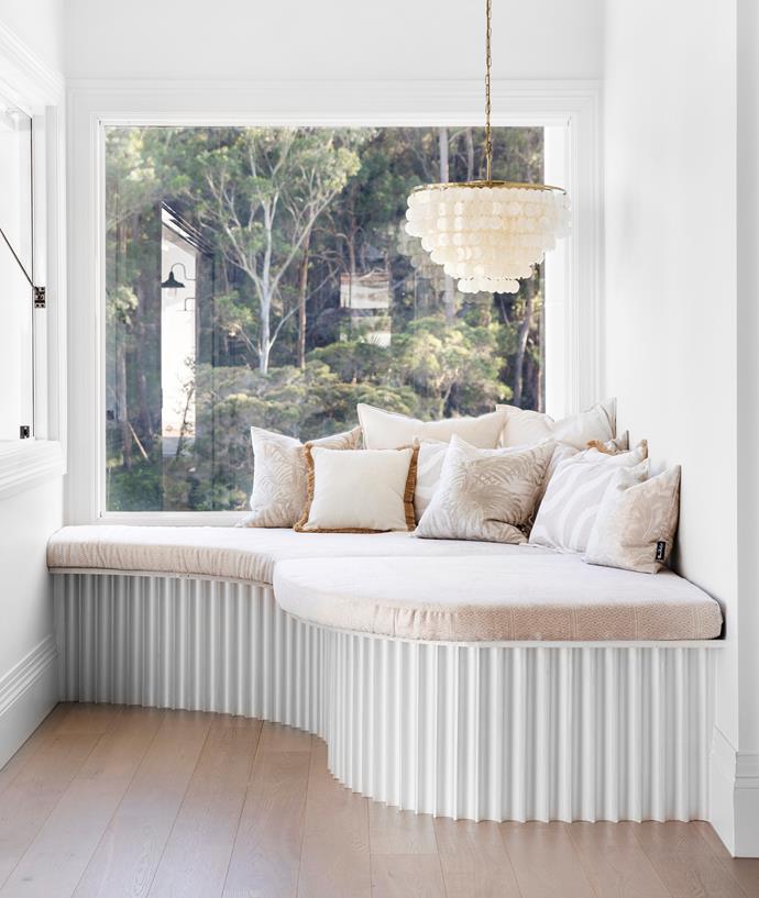 The glamorous window seat in [this light and airy resort-style home](https://www.homestolove.com.au/resort-style-home-three-birds-renovations-22500|target="_blank") by Three Birds Renovations is luxuriously-sized and doubles as a day bed. 