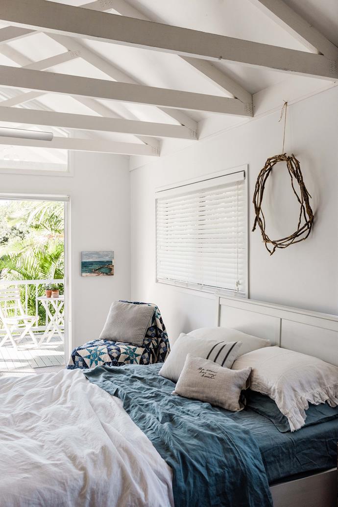 Katie and Kynan's bedroom features Wylie's Baths by local artist [Vicki Lemarseny](https://www.homestolove.com.au/peregian-beach-house-22286|target="_blank"|rel="nofollow") and an heirloom quilt.