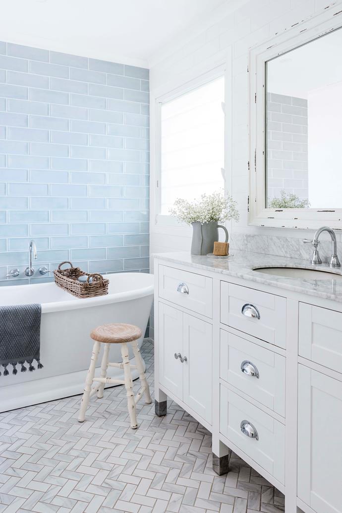 The bath is from [Early Settler](https://earlysettler.com.au/|target="_blank"|rel="nofollow"), while the marble-top vanity is from Vanity by Design.