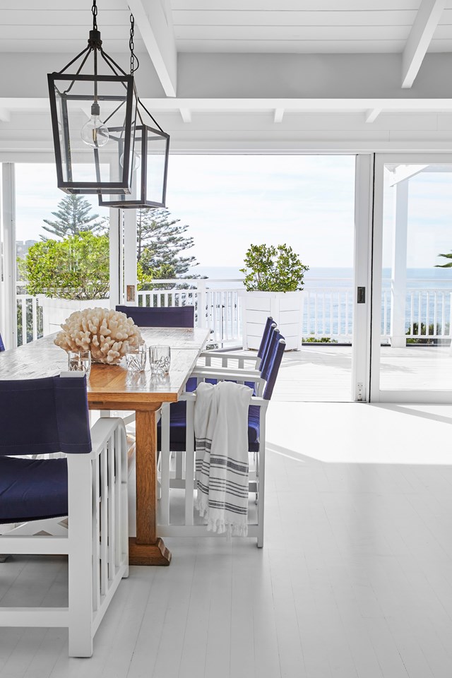 Sweeping views of the coastaline are the only thing that detract from the thoughtful interiors of this [crisp and contemporary beach house](https://www.homestolove.com.au/bungalow-55-founder-whale-beach-house-23308|target="_blank"). Filled with collected pieces and maximising the use of space with open plan design, it's a luxury retreat for relaxing and entertaining.