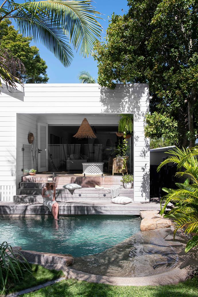 The 1990s lagoon-style pool was an existing feature that the homeowners really liked about [this original Queenslander workers cottage](https://www.homestolove.com.au/queenslander-workers-cottage-renovation-22995|target="_blank"). They decided to keep it and build the timber decking right up to the edge, so the house hugs the pool.