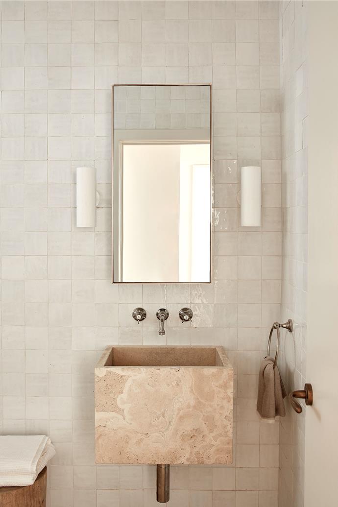 In the bathroom, walls are covered in Zellige wall tiles in Chalk. Stone trough made by GG Stoneworks and fitted with nickel tapware from the Astra Walker Olde English collection.
