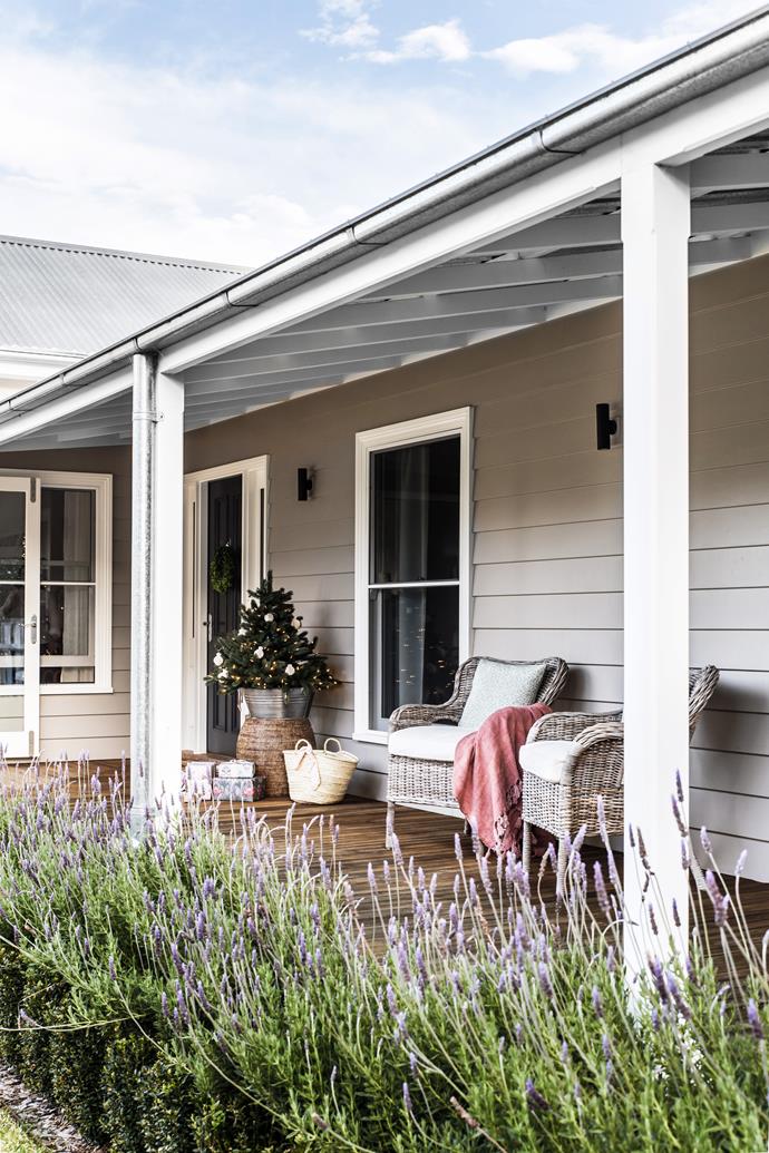 **HOME ON THE RANGE** With its wraparound verandahs and weatherboard cladding, Karon and Michael's home, which they share with their seven-year-old son, Alessandro, in NSW's Southern Highlands, is built for a blissful country life. At Christmas, guests spill out onto the verandah, glass of Prosecco in hand, as kids, giddy with excitement, run amuck on the lawn. "It's always a really relaxed gathering, with food constantly coming out," Karon shares.