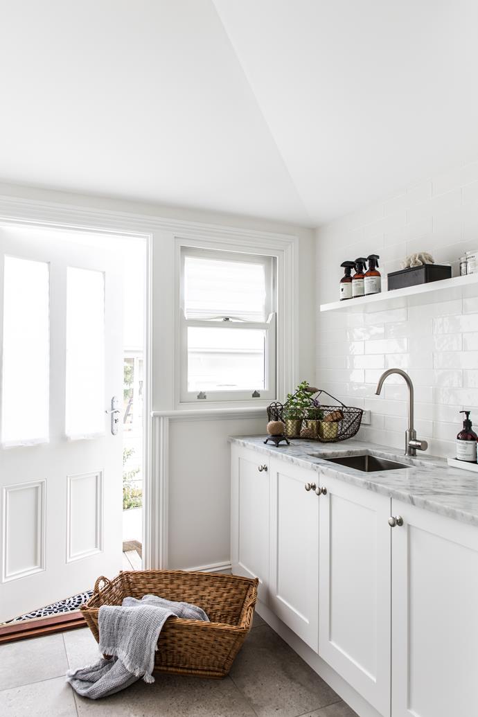 Carrara marble benchtops are a luxe touch in the laundry room.