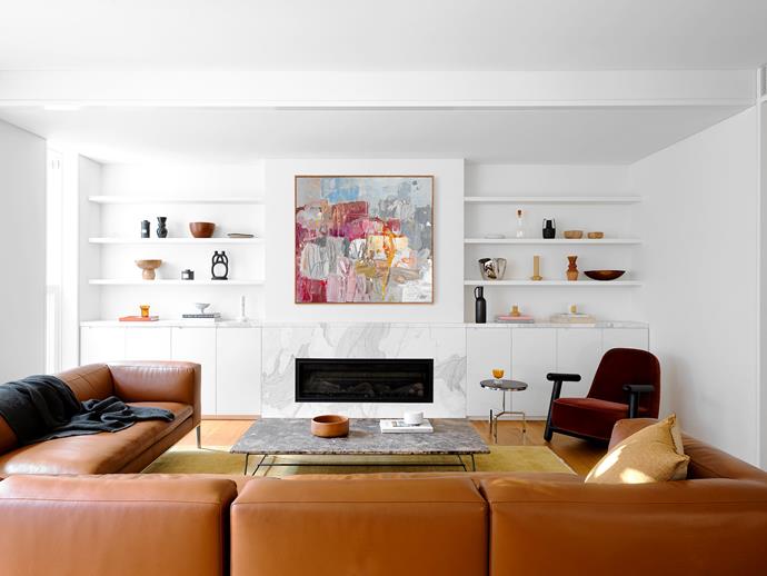 The artwork above the Heat&Glo 'Mezzo' fireplace by ClassicFires, is by Leah Thiessen, and is from Flinders Lane Gallery. The B&B Italia 'Michel' sofas are from Space.