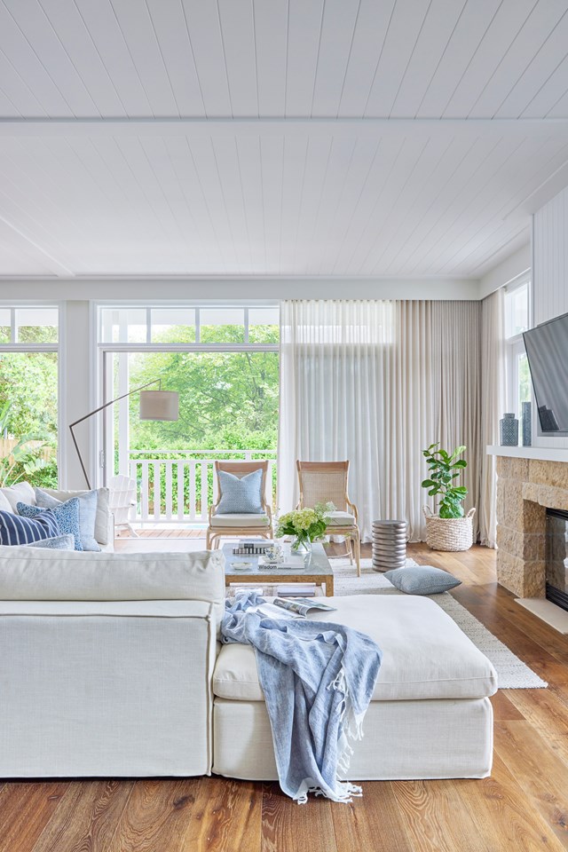 Stone is just part of the story of [this textured living room](https://www.homestolove.com.au/sydney-interior-designer-home-coastal-style-23326|target="_blank"), where a timber-lined ceiling is echoed in a white mantlepiece. A gas fireplace removes the need for a full hearth.