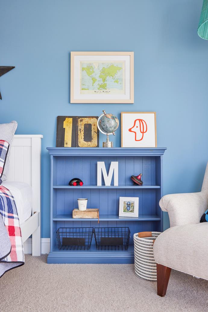 In Mac's room, a bookshelf displays decorative items, including a [Castle](https://www.castleandthings.com.au/|target="_blank"|rel="nofollow") 'Little Red Doggie' print.