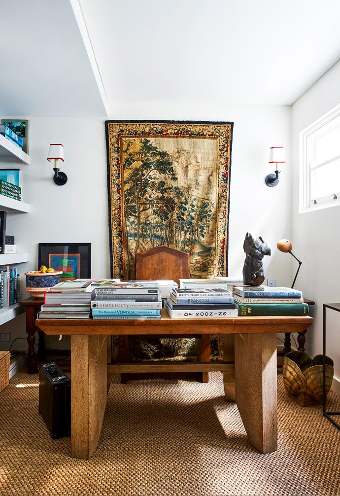 Presided over by a Flemish tapestry, this space is full of family treasures. The 1920s American oak desk was a kitchen table in one of Tamsin's former homes. "The coconut lamp has been a part of my life since childhood," she says.