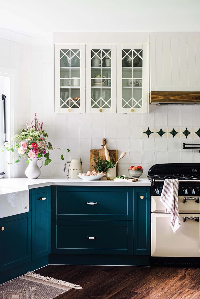 Nikki bought the black and cream tiles in Portugal after completing the Camino de Santiago walk. The joinery in the kitchen was custom-designed and installed by Hobbs with DIY Kit Kitchens, painted in Dulux Submarine (lower cabinets) and Dulux Alabaster (upper cabinets).