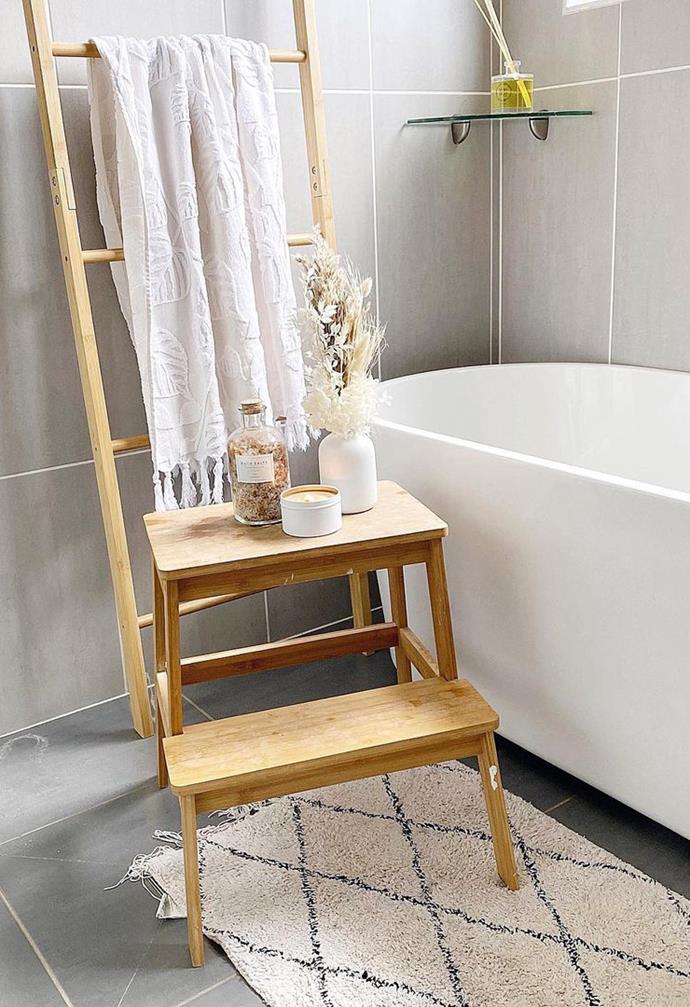 **BATHROOM RETREAT**<br>
This simple timber stool from Kmart turned [@lifeof.ashleigh's](https://www.instagram.com/lifeof.ashleigh/|target="_blank"|rel="nofollow") bathroom into an idyllic haven as a accessory-holding table for bathtub luxuries.