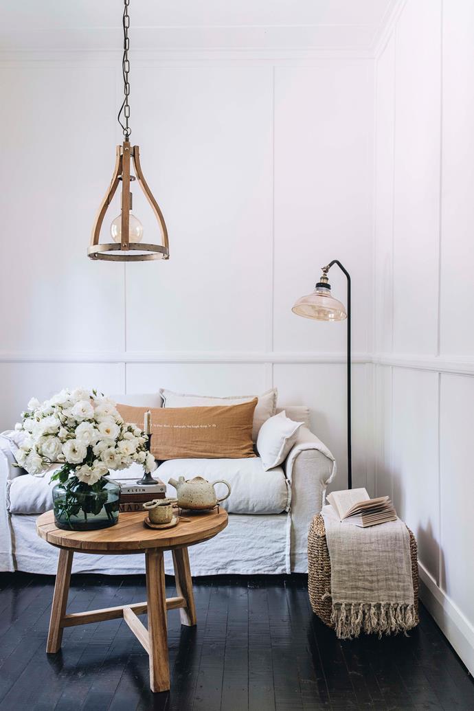 The painted timber floors are just one of the elements that add character to [Hargan's Cottage](https://www.homestolove.com.au/hargans-cottage-carcoar-nsw-22539|target="_blank"), a cosy bolthole in a town that time forgot. "We refreshed it all white, changed the blinds and painted the timber floors black, and added a wood fire," says homeowner Belinda Satterthwaite. 