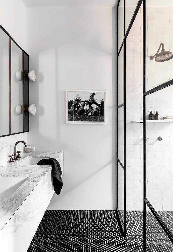 In interior designer [Jillian Dinkel's charming Federation home in Sydney](https://www.homestolove.com.au/jillian-dinkel-home-21167|target="_blank"), steel-frame partitions lead into a luxurious double shower.