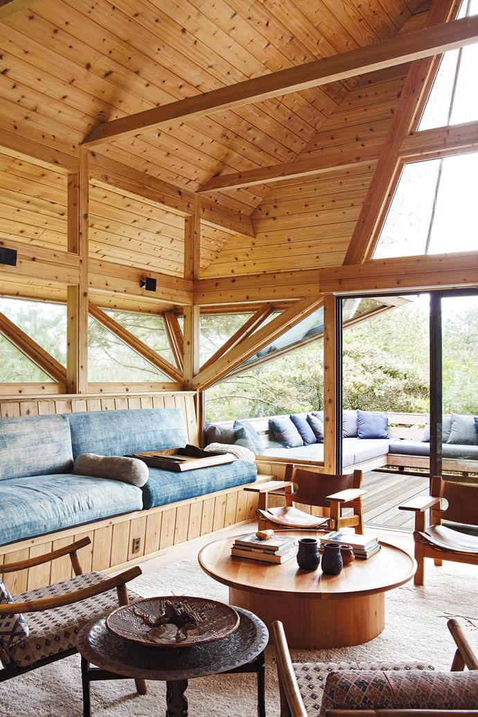 Architect Andrew Geller designed the cantilevered windows to reflect light off nearby sand dunes and illuminate the interior's A-frame ceilings. Original Mogensen 'Spanish' chairs and vintage designs. Coffee table, custom.