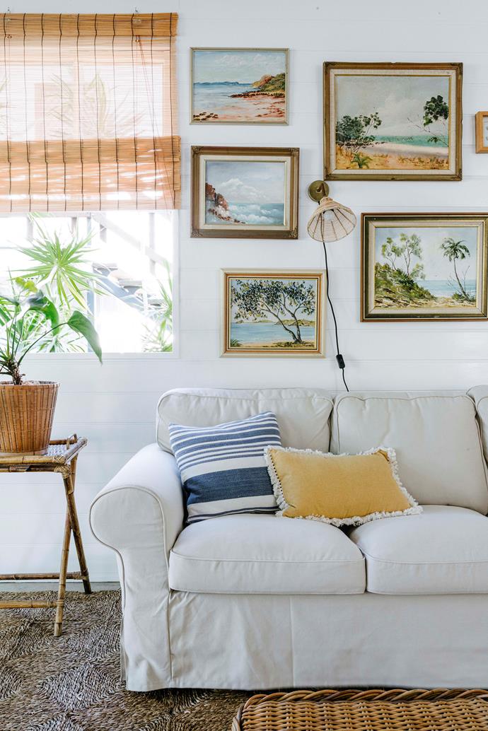 The family's 'great little room' with a cluster wall of collected seascapes from op shops and online stores. Emma's tip for creating a gallery wall is to "Buy what you really love, don't worry about different frames and always lay pieces out on the floor before hanging."