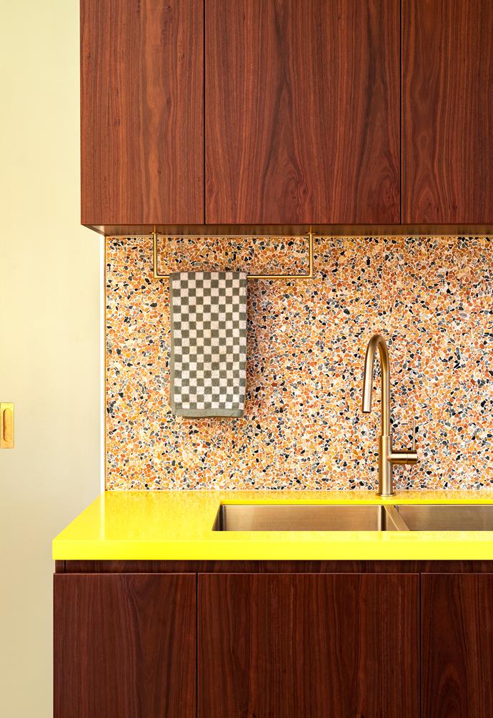 Timber, terrazzo and a banana yellow benchtop make for a fun palette in the kitchen.