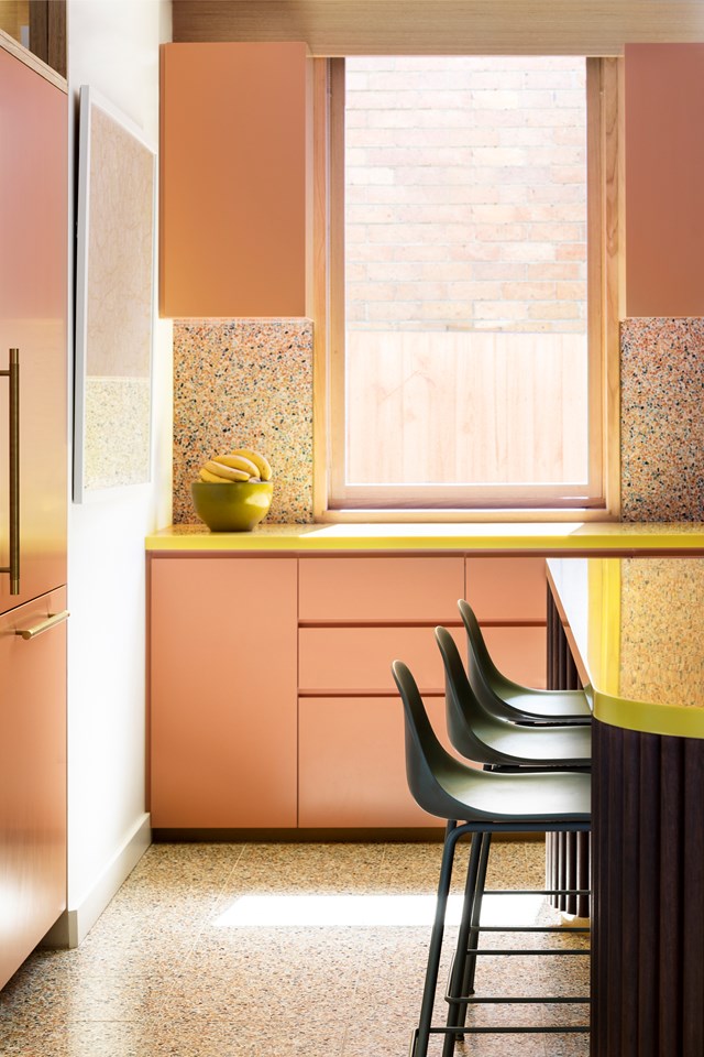 Think of your kitchen splashback as the perfect place to experiment with colour and pattern. Take these coloured terrazzo tiles, which add depth while an influx of natural light enhances the colourful combination. A banana yellow benchtop also makes for a fun palette in the kitchen.

*Photographer: Martina Gemmola*