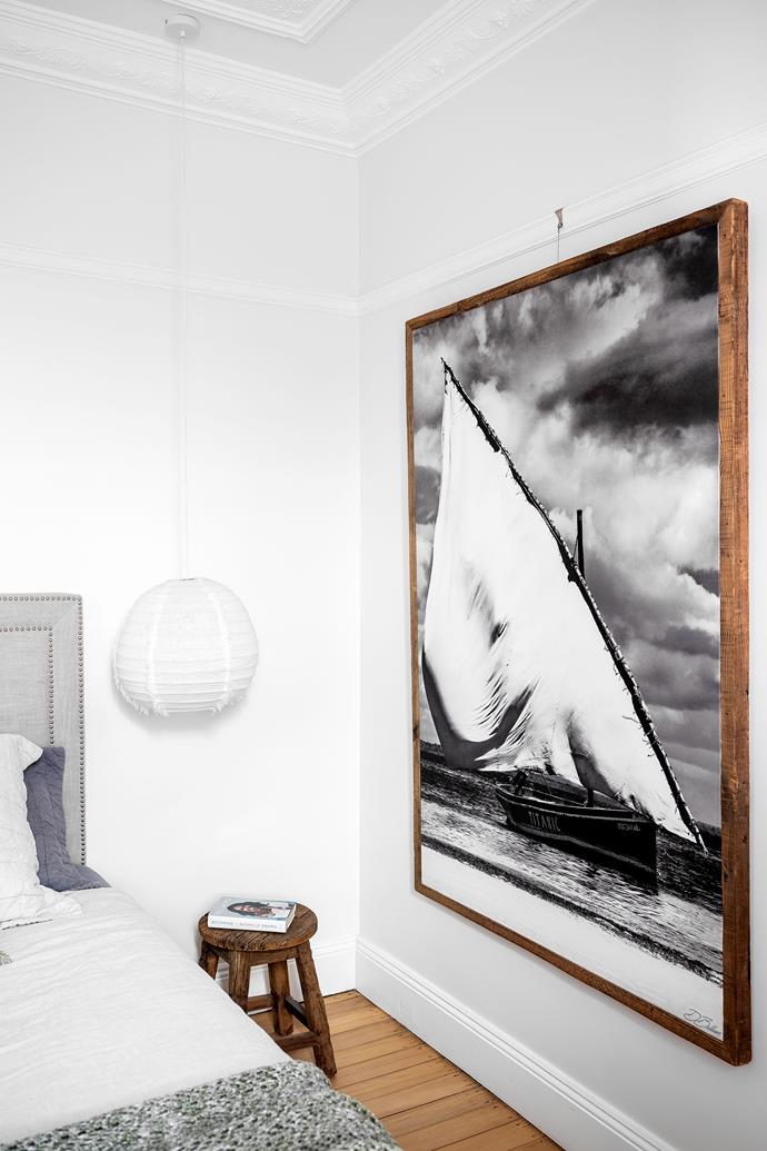 The artwork in the main bedroom is by David Ballam. The bedside stool is from Emporium Avenue and the pendant light is from Beachwood Designs.