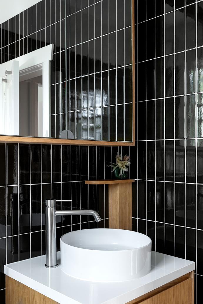 In the bathroom, the walls are lined with Piombo tiles from Academy Tiles+Surfaces.
