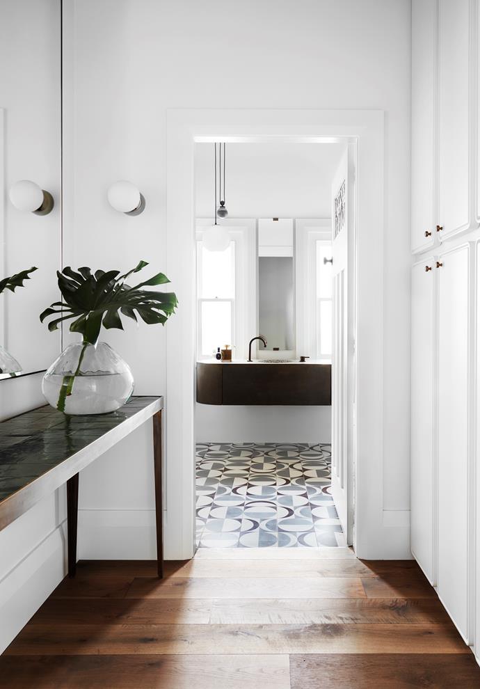An unexpected hit of pattern is delivered in the custom monochromatic floor tiles in the bathroom of [this heritage home with a contemporary update](https://www.homestolove.com.au/heritage-house-contemporary-renovation-22861|target="_blank"). 
