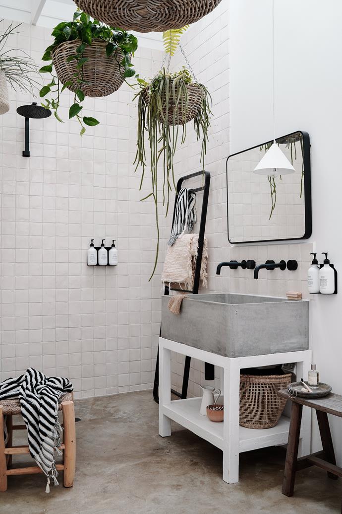 The square tiles in [this barn-style home](https://www.homestolove.com.au/small-barn-style-home-21098|target="_blank") are laid in a checkerboard grid pattern rather than the more common brickwork style, which gives this room a sense of drama while still remaining a calm and serene space.