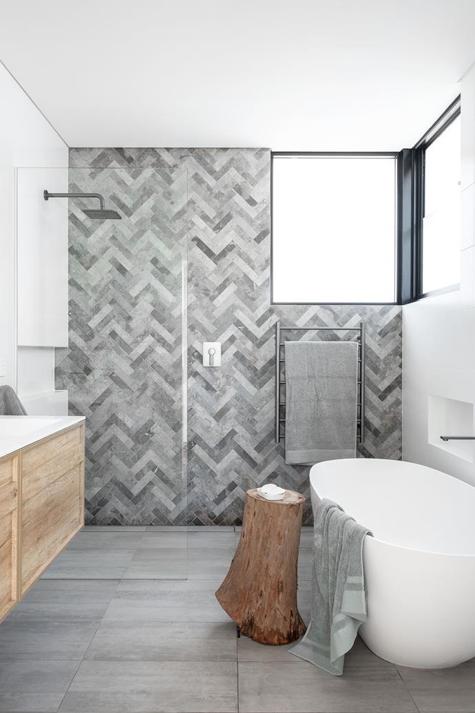 Marble tiles are laid in a stunning herringbone pattern in the bathroom of [this original 1910 Federation home](https://www.homestolove.com.au/historic-home-architect-extension-manly-nsw-23347|target="_blank") in Sydney's Northern Beaches. 