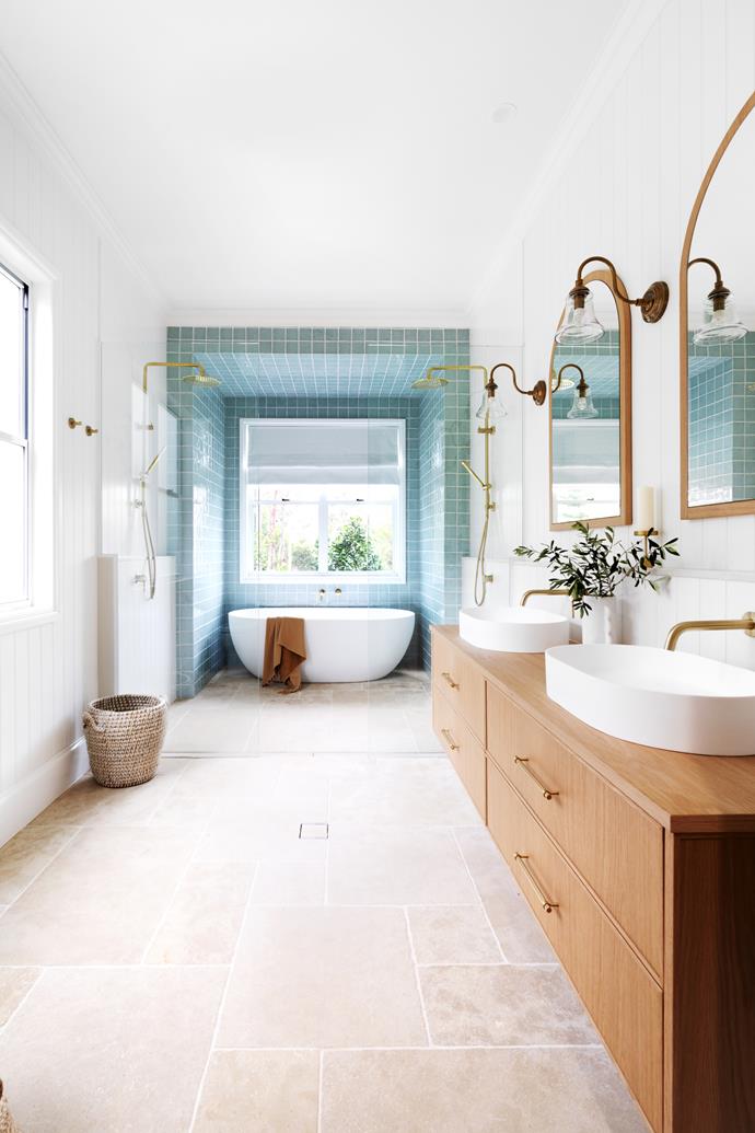 Timber benchtops aren't limited to kitchens; in [this bathroom](https://www.homestolove.com.au/modern-country-farmhouse-brisbane-23394|target="_blank"), a natural oak vanity designed by Front Porch Properties, and manufactured by Farmers Doors, adds tactile warmth.