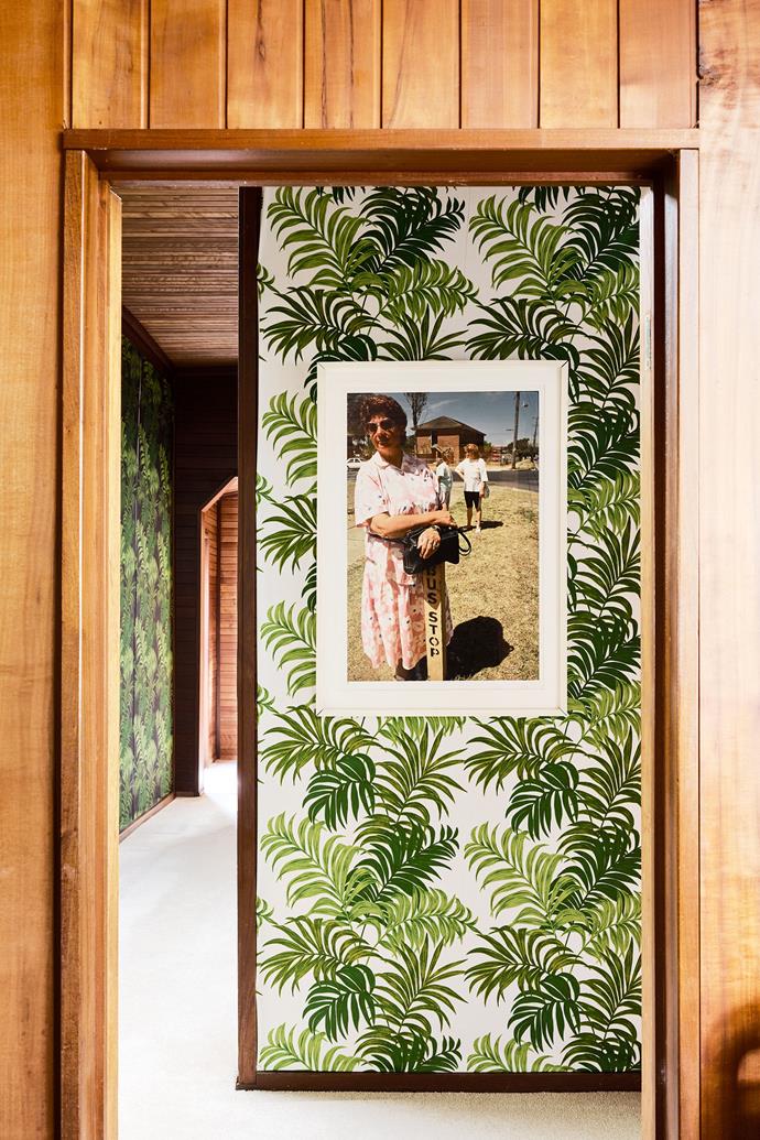 In the hallway of [this magical Modernist-inspired property](https://www.homestolove.com.au/boat-access-only-sydney-pittwater-home-23327|target="_blank") that is only accessible by boat, vintage fabric was upholstered on the walls to bounce light and introduce brightness to the otherwise earthy space without painting over the original 1896 timber panelling.