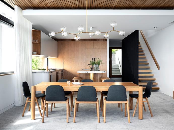 In the dining room, the 'Huxley' dining table and 'Bay' dining chairs are from Jardan. The Branch bubble chandelier is [Griffin Design](https://www.wescover.com/creator/giffin-design|target="_blank"). The Halcyon curtains framing the windows are from Simple Studio.