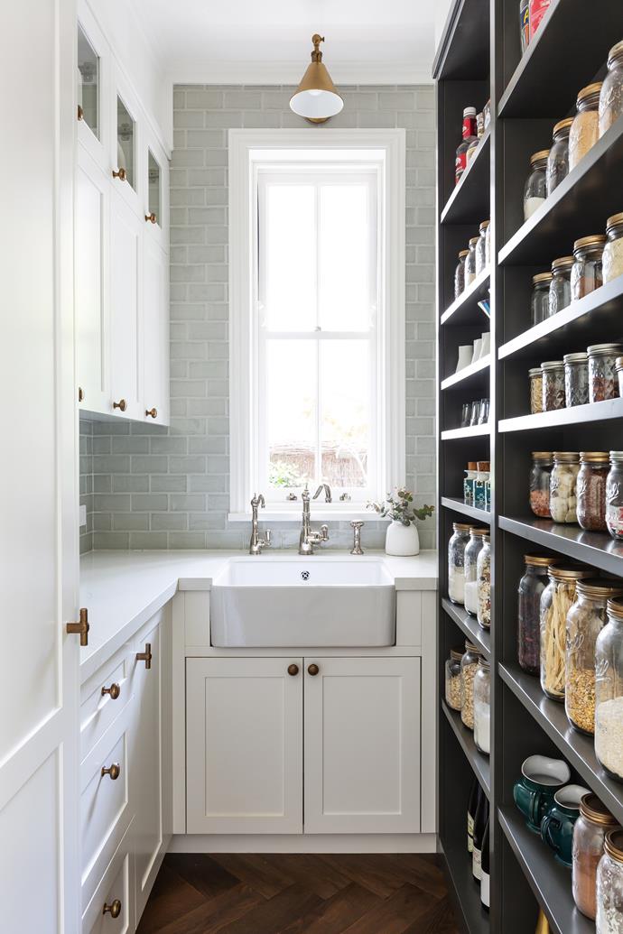 **PANTRY** Small is beautiful in the pantry, where polished-nickel Perrin & Rowe taps adorn a butler's sink (try Ikea), and soft sage subways from Tiles by Kate highlight the pretty-as-a-picture sash window. 