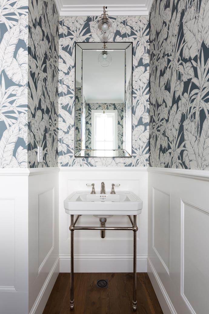 **POWDER ROOM** Squeezing as much joy into the tiny space as possible, Laura decorated with a Pottery Barn bevelled mirror, a classic Perrin & Rowe washstand and a splash of [Scion's](https://www.scionliving.com/wallpaper/|target="_blank"|rel="nofollow") 'Parlour Palm' wallpaper in Charcoal.