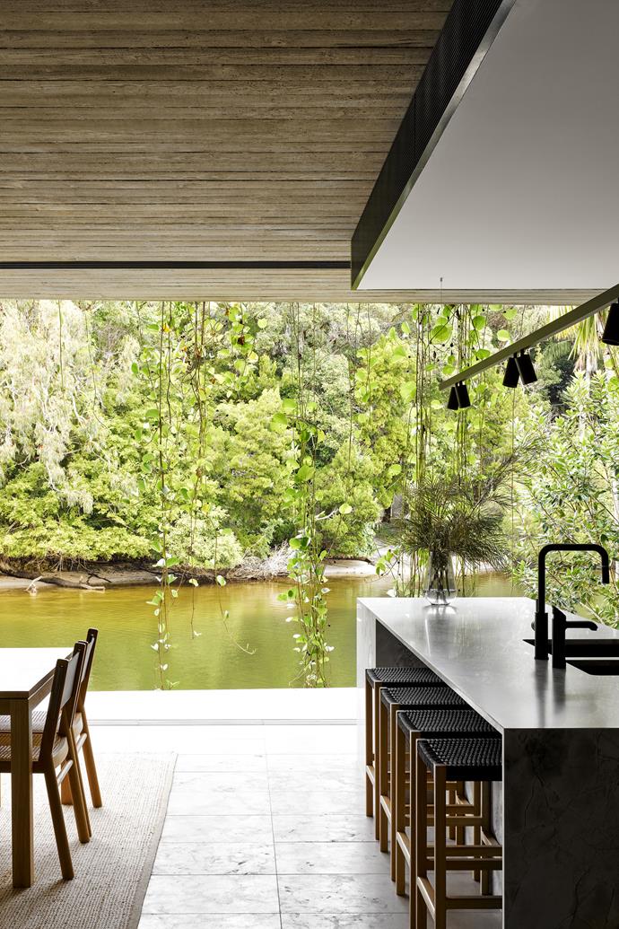 The indoors and outdoors are blurred to create continuous and fluid spaces. River views add serenity to the living areas.