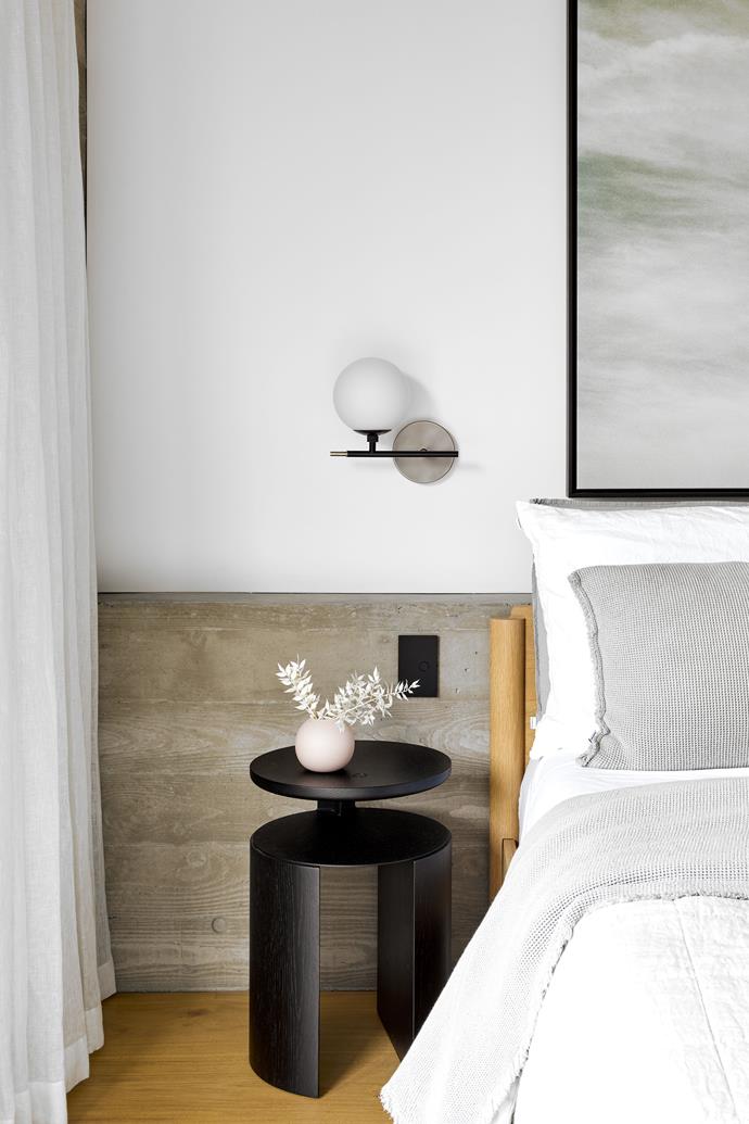 A photographic work by Annelie Vandendael is found in the guest bedroom, which includes a side table from Mast Furniture with a [vase from Marmoset Found](https://www.davidjones.com/home-and-food/new-in/22735259/Cloud-Bubble-Vase.html|target="_blank"|rel="nofollow"). Sconce from Snelling.