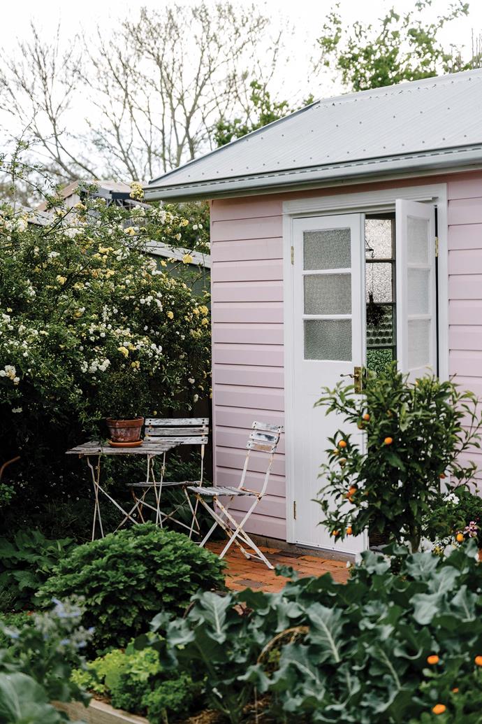 Surrounded by fruit trees and delicate florals, this [pink cottage in Queensland's Toowoomba](https://www.homestolove.com.au/pink-cottage-with-colourful-country-garden-23443|target="_blank") is full of much-loved vintage finds that remind the owner of her grandmothers, Eleanor and Ruby. "So much of the garden, the summer house and the main house are built on them and my love for vintage," shares Leisa, who created the space alongside her husband, Serge.
