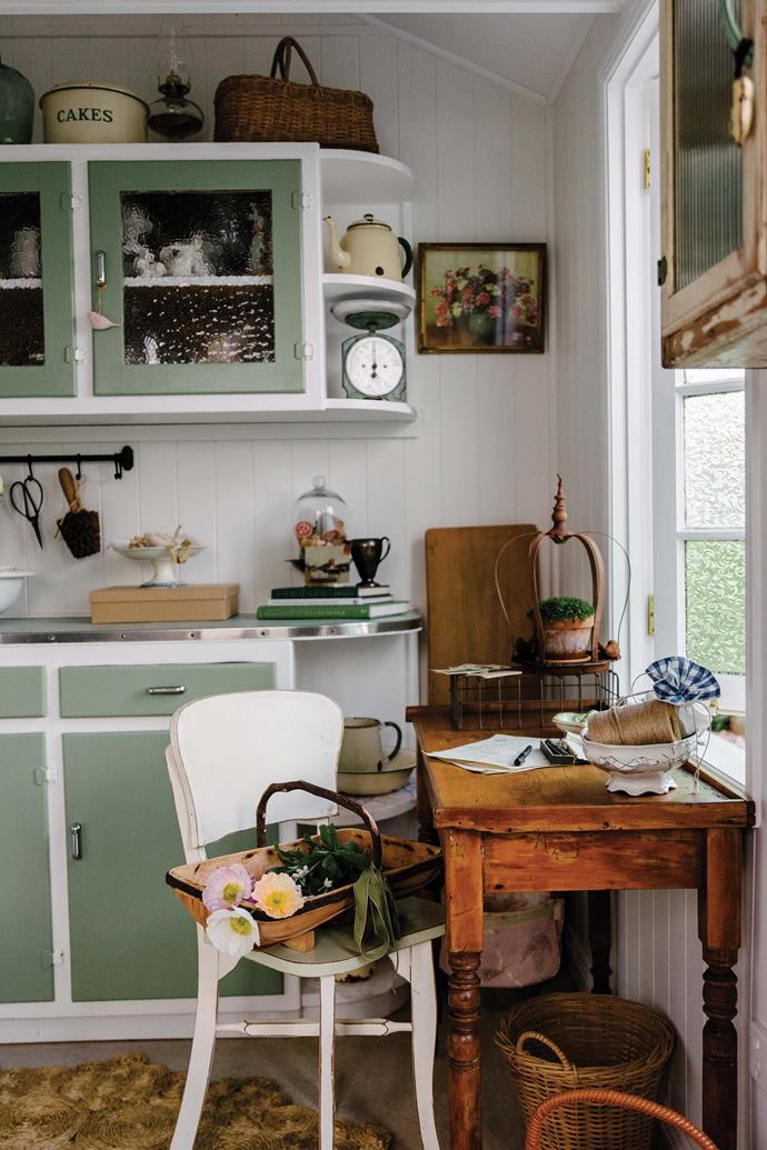 Colour runs throughout this [vintage-inspired cottage in Toowoomba](https://www.homestolove.com.au/pink-cottage-with-colourful-country-garden-23443|target="_blank"), whose exterior is painted a gorgeous powder pink. This retro kitchen came directly from owner Leisa's grandparents' farmhouse – the original green laminex has been matched and now features on the cabinet fronts.