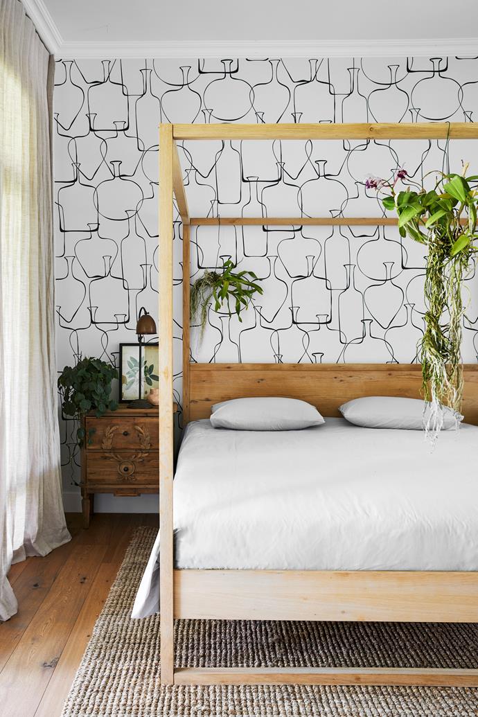 **MAIN BEDROOM** A quiet palette promotes rest and relaxation in the couple's bedroom, where honey-hued timber floors (get the look at Polyflor), crisp bed linen and a striking wallpaper by [Cara Saven Wall Design](https://carasaven.com/us/|target="_blank"|rel="nofollow") are enlivened by pops of colour courtesy of lush indoor plants expertly cared for and displayed by passionate – and talented – green-thumb Angela.