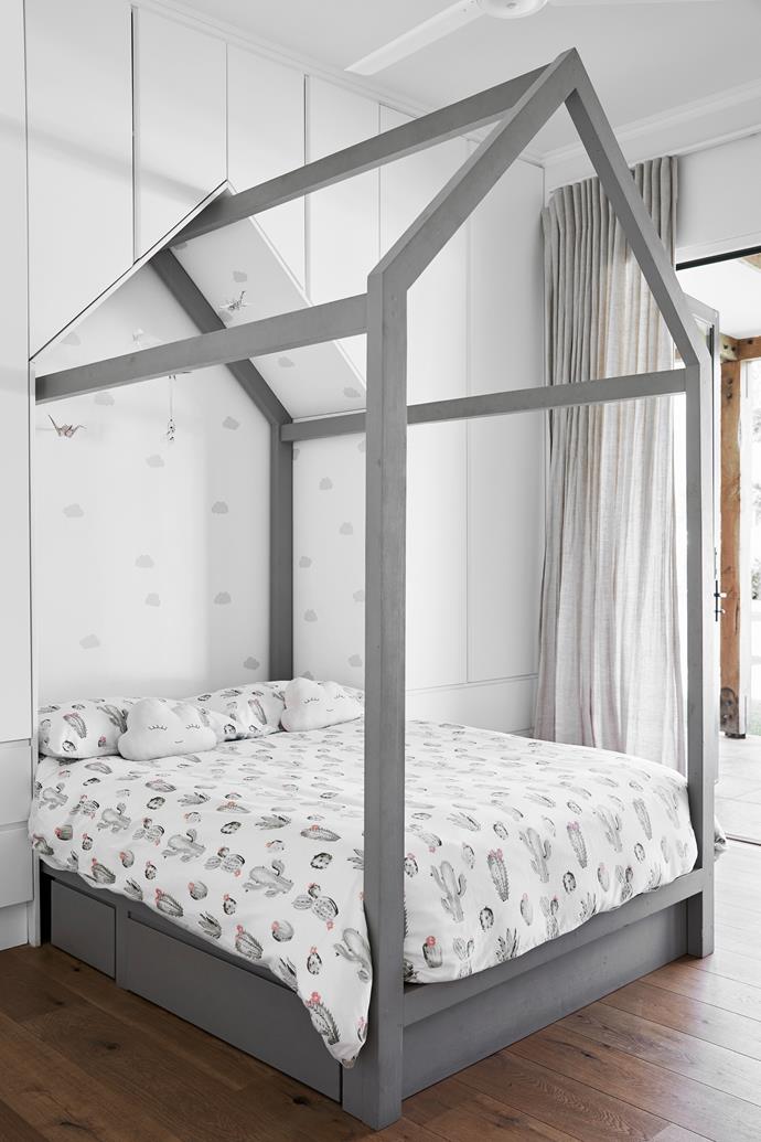 A custom-built bed frame lends a fairytale touch to Amber's bedroom.