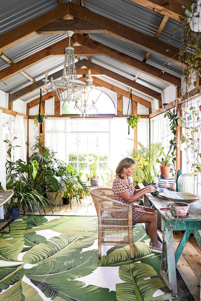 **GARDEN STUDIO** Built from windows, doors and beams salvaged during the renovation, and lit by boho-style chandeliers (try the Wooden beaded 9-head chandelier in White from Litfad), this outdoor room reflects the couple's commitment to creating a space to nourish creativity. It's where Angela (pictured above) tends her [orchid collection](https://www.homestolove.com.au/how-to-grow-orchids-9793|target="_blank") and indoor plants, where Justin recently wrote a children's book and it's also a venue for yoga workshops and self-development courses.