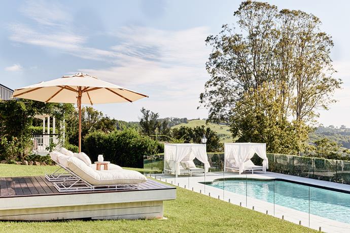 Guests can recline in linen-draped cabanas next to the 14-metre pool with stunning views across the macadamia farm.