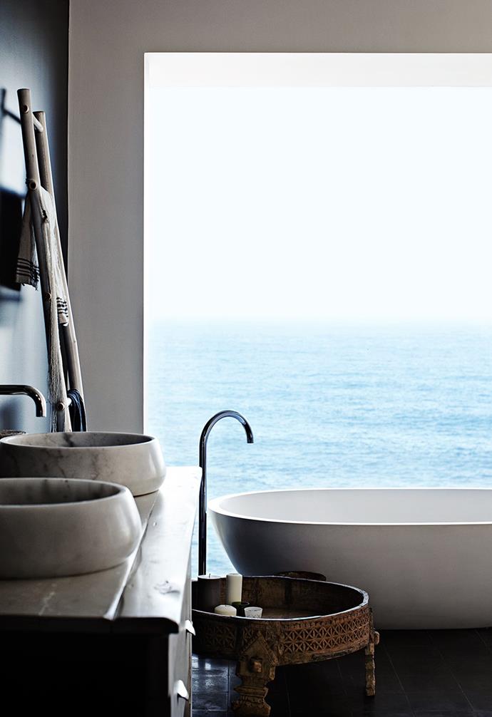 If peace and serenity are top of your bathroom wish list, look no further. The stone bath and basins of this gorgeous space are the epitome of calm, not to mention the breathtaking ocean view.