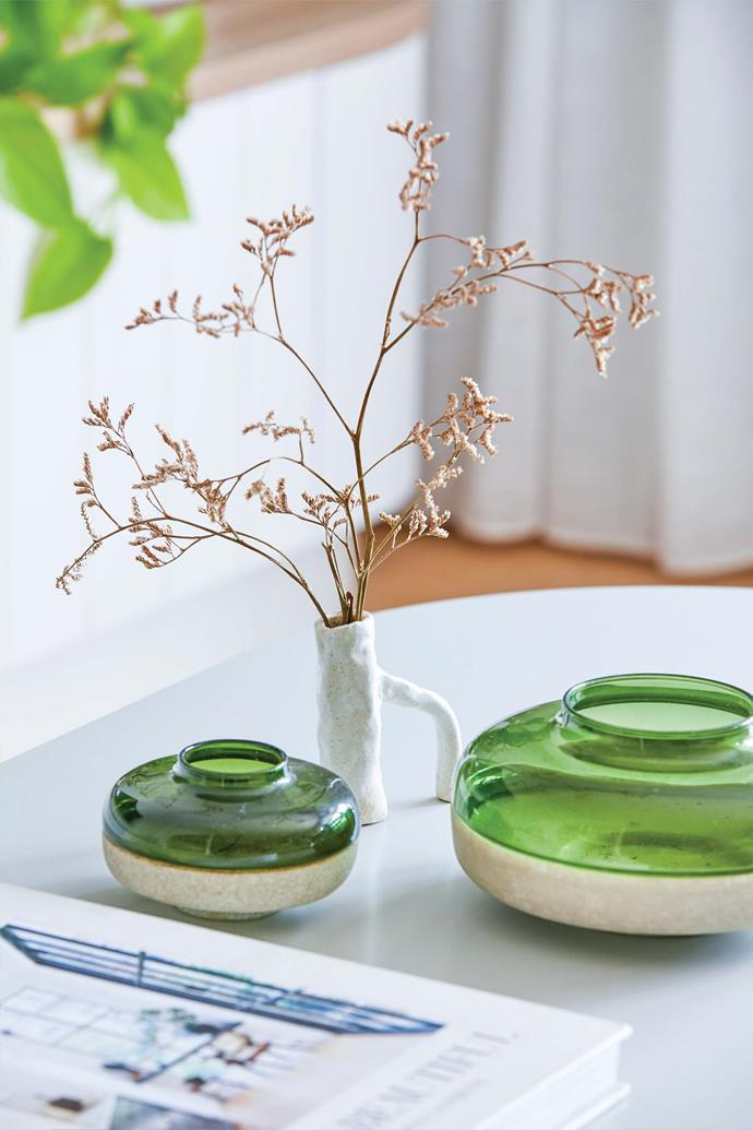 The two green vessels and handmade stem vase, all stylist's own, are arranged on a Clifton marble-based coffee table from [West Elm](https://www.westelm.com.au/|target="_blank"|rel="nofollow").