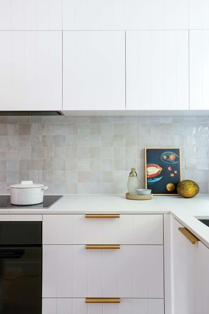 A larger footprint was created by borrowing space from a powder room near the front door. Shelley saved money on a reasonably priced [Caesarstone](https://www.caesarstone.com.au/|target="_blank"|rel="nofollow") benchtop in Fresh Concrete, giving her extra to splash out on the splashback: handmade Moroccan Zellige tiles in Bianca Casa from [Di Lorenzo](https://dilorenzo.com.au/|target="_blank"|rel="nofollow"). Still Life With Citrus artwork by Rachel Stevens from [Palette By Jono Fleming](https://palettebyjonofleming.com/|target="_blank"|rel="nofollow").