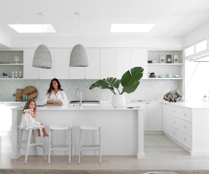 **KITCHEN** Joinery in Polytec Blossom White and benchtops in Caesarstone Pure White, are complemented by 'Jok' stools from [Blu Peter](https://blupeter.com.au/|target="_blank"|rel="nofollow"). Vulcano Clay 'Moroccan Bejmat' tiles from Myaree Ceramics create a textured splashback. "It symbolises our travels in the past and I have a thing about kitchen splashbacks," says Kristie. "This looks like the reflective inside of a pearl shell." 'Bungalow' pendants from Beacon Lighting. "I dislike symmetry, so the two pendants, not the usual three, are mounted off to the side for a sense of movement," says Kristie.