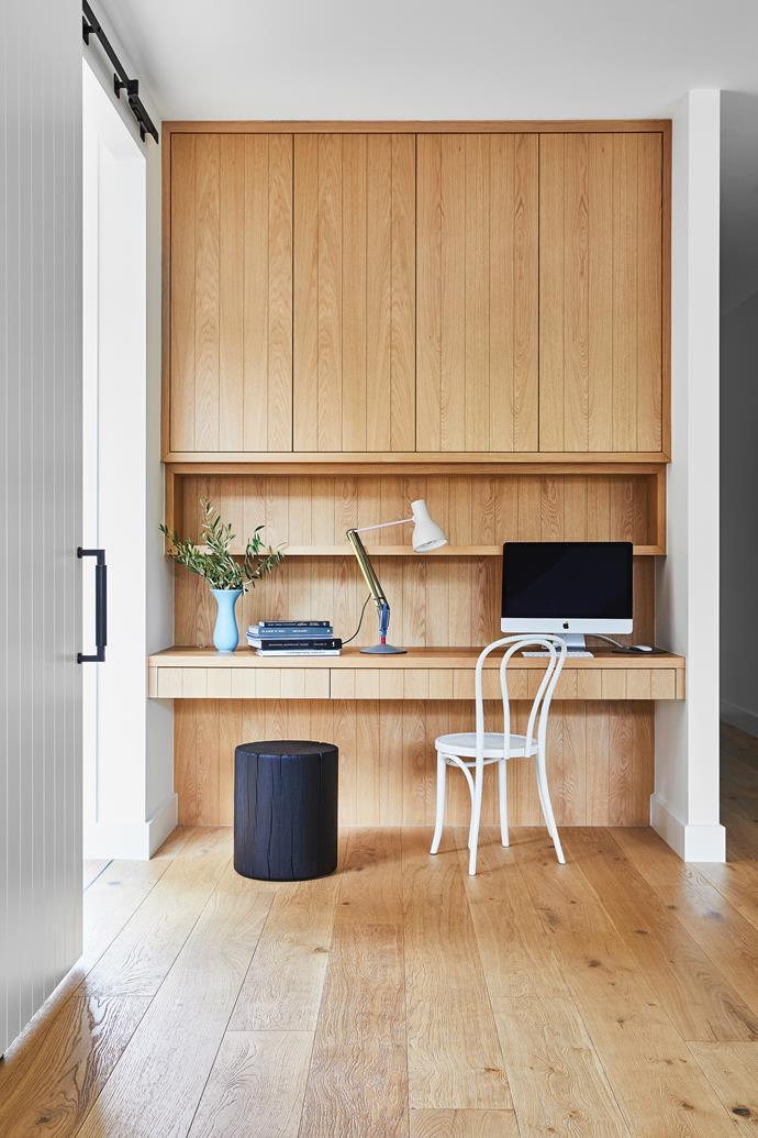 Between the living areas and the bedroom wing is this tucked-away desk space adjacent to the front door, so there's no delay when visitors pop round. Black stool, [Mark Tuckey](https://www.marktuckey.com.au/|target="_blank"|rel="nofollow").