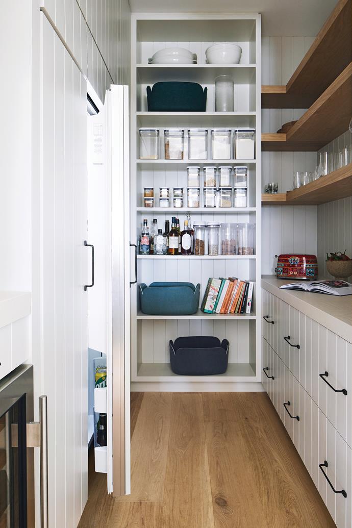 Vertically stacked tiles in the kitchen are mirrored in the lines of this space. A [wine fridge](https://www.homestolove.com.au/best-wine-fridges-19547|target="_blank") is tucked under the bench.