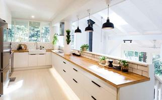 White and Scandi-style IKEA kitchen with timber bench top