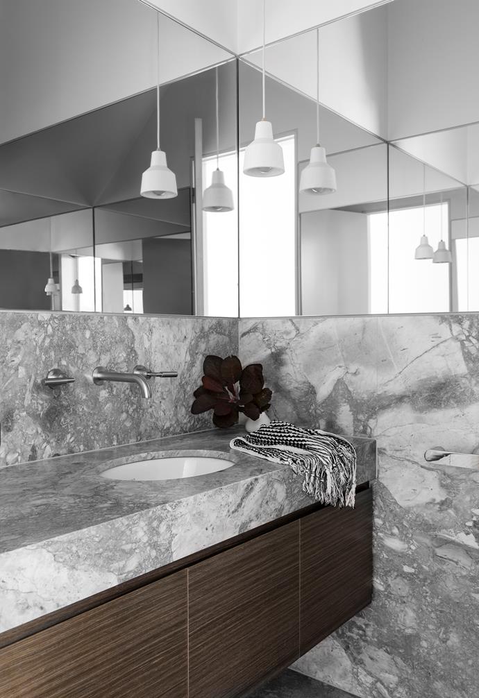 Making a splash In the powder room, Super White Dolomite stone from CDK Stone lends drama to a small space. It shares the same veining as some marbles but is denser, less porous and less likely to chip. Brushed nickel taps offset the stone to great effect. Towel from Loom.